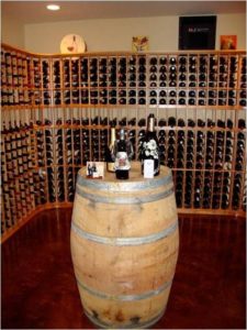 Commercial Wooden Wine Racks with Wooden Barrel Table Top at the Center of the Wine Cellar