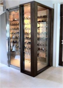 A Contemporary Wine Closet with Glass Walls and Glass Door