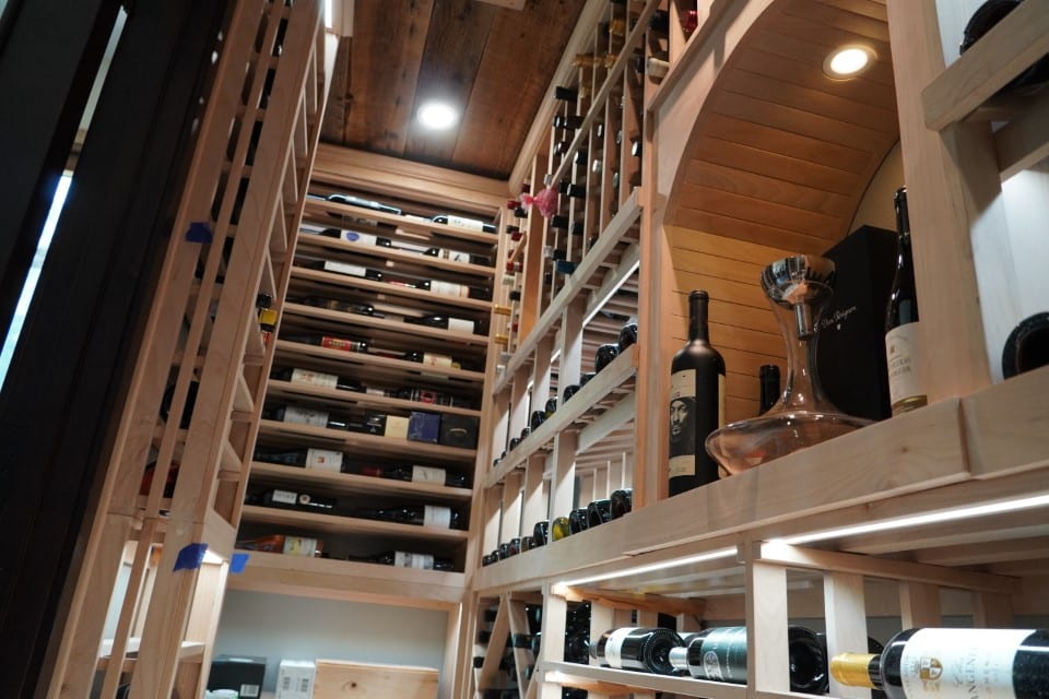 walk in Miami Florida wine room with custom wood wine racks