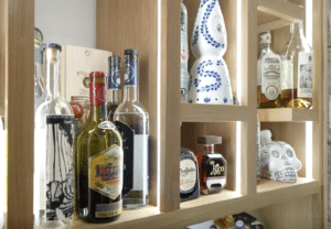 Contemporary tequila compartments in wine cellar with custom light channels