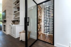 open glass wine cellar door entryway to modern wine cellar