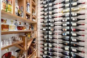 custom metal and wooden wine racks in modern wine cellar