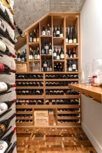 traditional wood wine rack in modern wine cellar