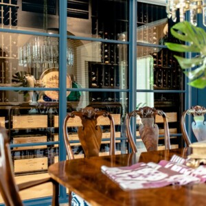 51 - Elegant Modern Wine Cellar with blackout window beside a dining area in Orlando