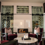 This wine wall features 5 separate compartments, each cooled and insulated, with glass doors revealing the treasures inside.