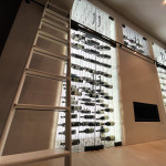 Wine storage is more than just building a cellar. For this home wine closet, a rolling ladder makes it easy to access every bottle.