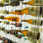 With the modern wine cellar lighting panels set to bright, the beautiful bottles in this collection are illuminated.