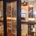 These glass panels are double-paned and tempered which meansthat they don't fog no matter how hot the temperature outside can become. Our wooden wine racks looked ultra-stunning through these glass panels and we made it look more of a picture from the outside by using a stainless steel frame on the glass panels.