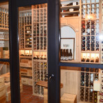These glass panels are double-paned and tempered which meansthat they don't fog no matter how hot the temperature outside can become. Our wooden wine racks looked ultra-stunning through these glass panels and we made it look more of a picture from the outside by using a stainless steel frame on the glass panels.