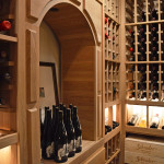 When you step inside this wine cellar, you'll hear nothing from the air conditioning unit. A quiet wine cooling system is important to keep the wines within the wooden wine racks protected from vibrations.