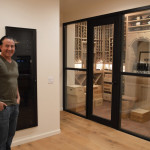 Even without going near this wine cellar, you can already see the entirety of the wooden wine racks through the termpered glass panels