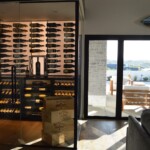 Even in broad daylight, this glass wine room looks stunning when you turn on the LED lights.